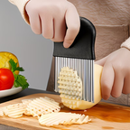 A stainless steel wavy potato slicer